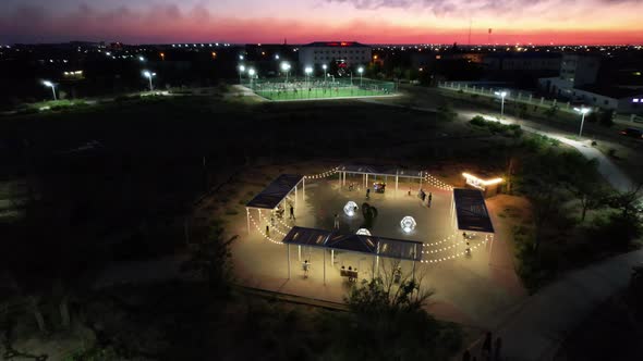 People are Relaxing in the Evening Park