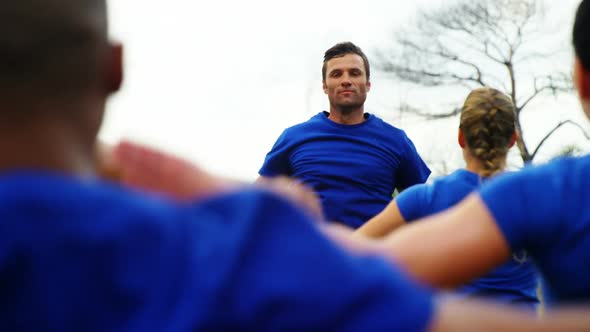 Fit people performing stretching exercise 4k