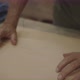 Old hands pushing down glued wood - VideoHive Item for Sale