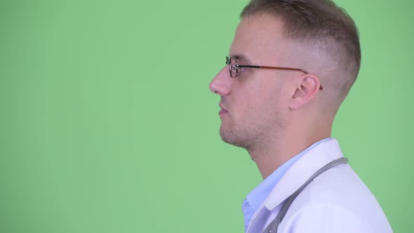 Closeup Profile View of Happy Handsome Man Doctor Talking