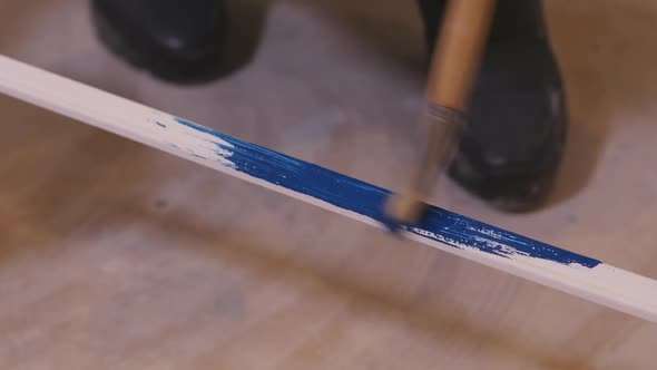 Girl Paints Plinthl With A Roller