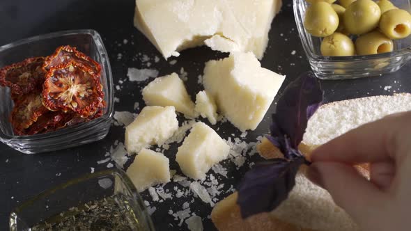 Video of Traditional Italian Food  Parmesan Cheese Dried Tomato and Olive