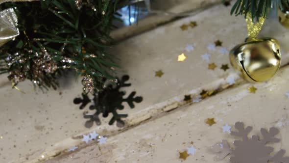 Wreath with christmas decoration on a plank