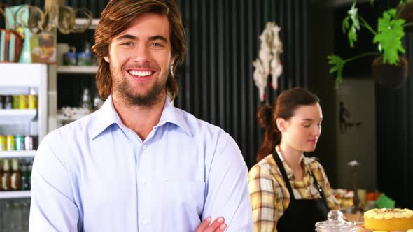 Smiling man standing at counter