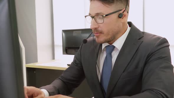 Business People Wearing Headset Working in Office