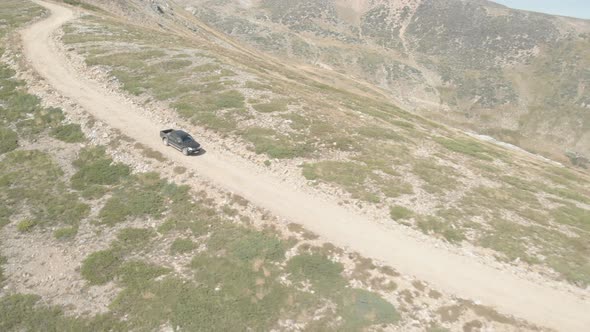 Truck Going Down a Mountain Dirt Road