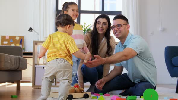 Happy Family with Children Playing at Home