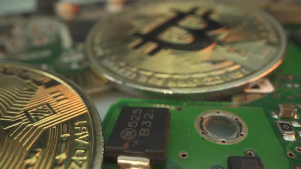 Two Gold Bitcoin on the Micro Chip. Macro Shot. Finance Concept. Investment in Digital Crypto