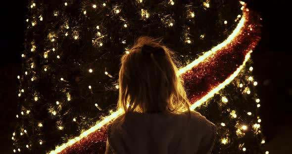 Little Girl at the Christmas Tree