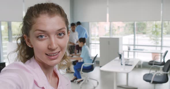 Close Up of Young Businesswoman Looking at Camera and Talking Having Video Call on Smartphone