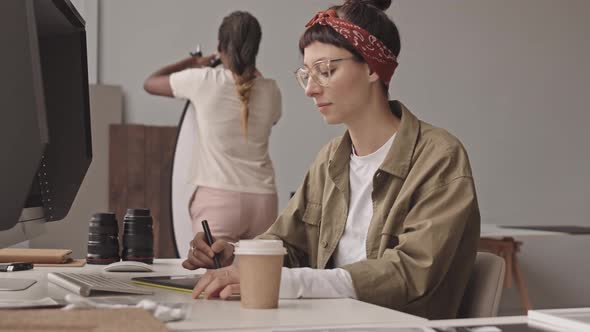 Female Photographer Working on Graphic Tablet