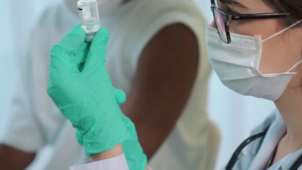 Young Man Visits Skillful Doctor at Hospital for Vaccination