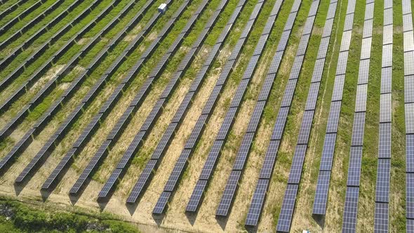 Aerial view of solar power plant field. Electrical photovoltaic panels for producing clean ecologic