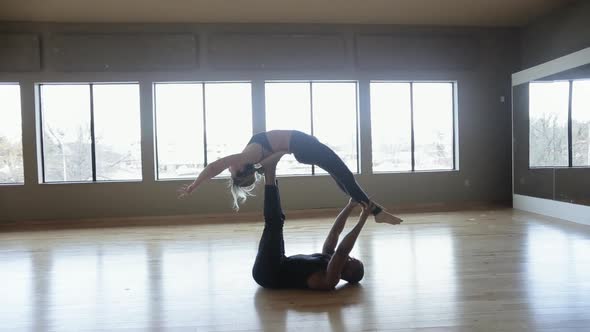 Partner Yoga performance done by two professional instructors