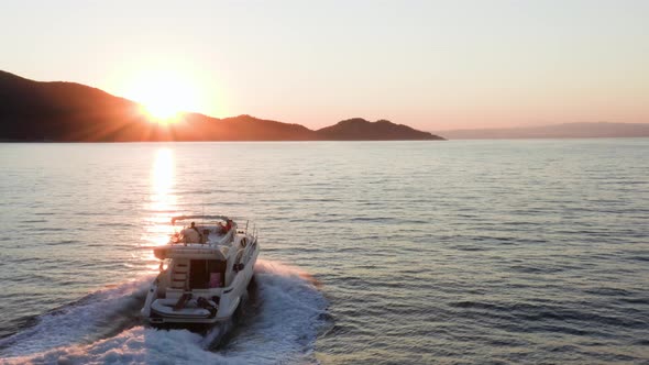 Fast moving motor yacht at the sea.