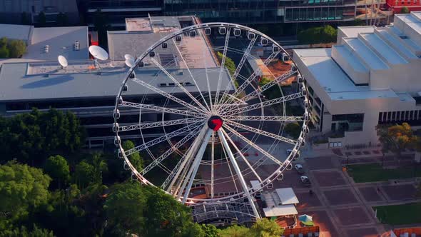 Brisbane Eye, Ferris Wheel Near South Bank Parklands At Sunset In QLD, Australia. - aerial