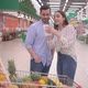 Attractive happy millennial couple checking a grocery bill receipt in supermarket - VideoHive Item for Sale