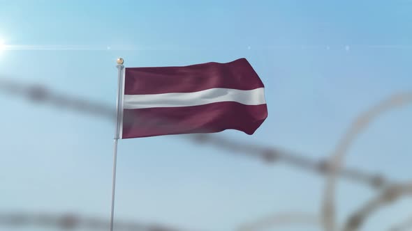 Latvia Flag Behind Border alt