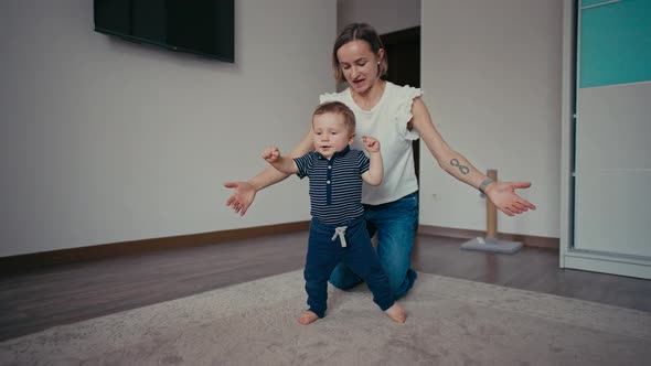 Cute Smiling Baby Boy Learning to Walk