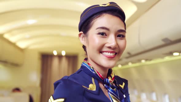 Cabin Crew or Air Hostess Working in Airplane