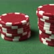 A Closeup Poker Shot of Color Chips Man's Hand Doing a Bet Red Chips Sliding Toward Camera - VideoHive Item for Sale