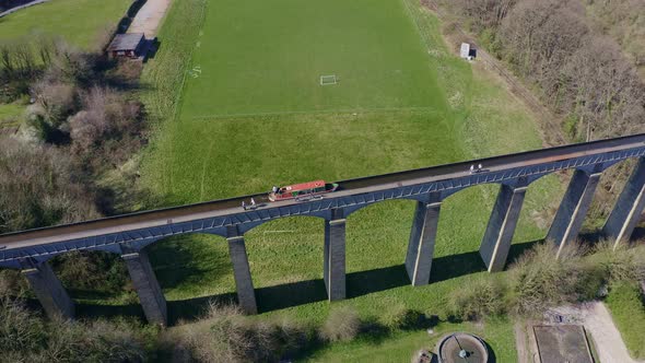 A Narrow Boat Crossing the Pontcysyllte Aqueduct famously designed by Thomas Telford,  located in th