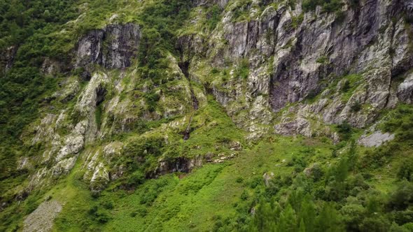 Drone shot of a steep rocky mountain in the swiss alps. aerial shot