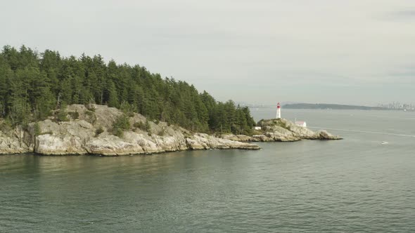Horseshoe Bay Lighthouse Park, cloudy morning light. Point Atkinson Lighthouse in drone aerial shot