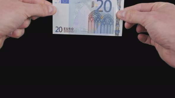 Male Hands Show a Banknote of 20 Euros From Top to Bottom with Alpha Channel