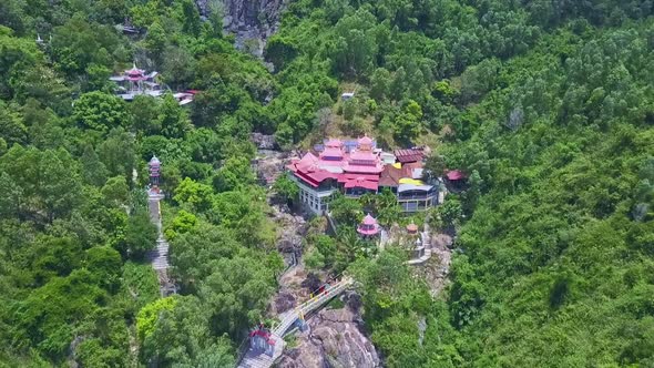 Drone Moves To Beautiful Buddhists Temple in Green Forest