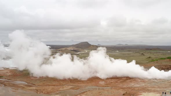 Hot Steam Coming From The Ground In A Geothermal Area In Iceland - aerial drone shot