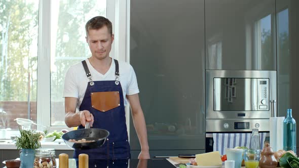 Cook Tossing Pan with Chopped Meat