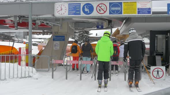 Skiers heading to a chairlift