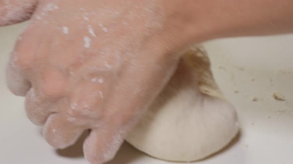 Dough manually bake job  close-up 4K 2160p UHD footage - Bakery work with dough with slow panning  4