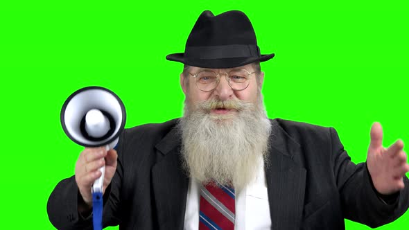 Senior Man with Megaphone on Green Screen