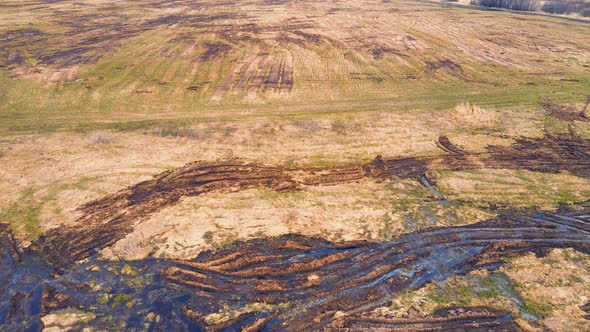 Scattered Heaps of Manure on an Agricultural Field Aerial View