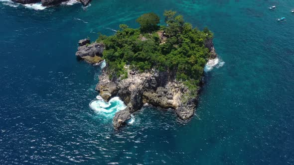 Indonesia. Aerial view at sea and rocks. Blue water background from top view