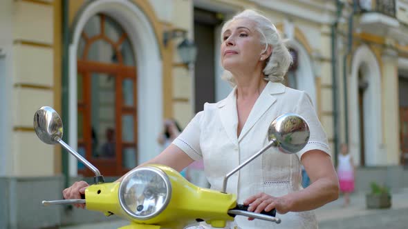 Woman on a Scooter.