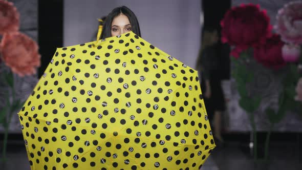 Posing Attractive Girl Hold Umbrella Catwalk Model Show Vogue. Woman on Podium.