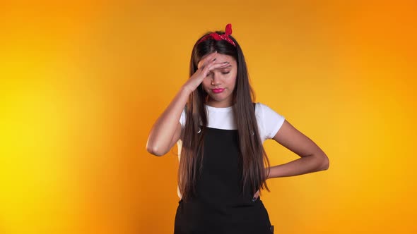 Young Beautiful Woman with Long Hair Having Headache, Studio Portrait. 