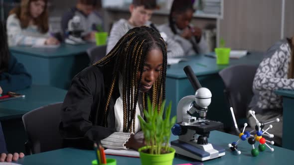 Smiling African American Girl Posing in Classroom