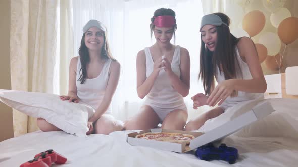 Happy Girls in Sleepwear Ordered Pizza for Bridal Shower