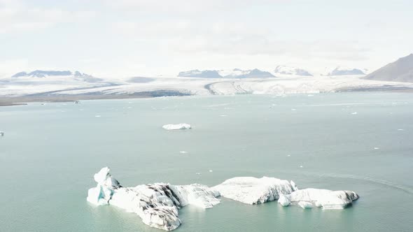 Aerial ascending shot of the glaciar lake jokulsarlon in summer.