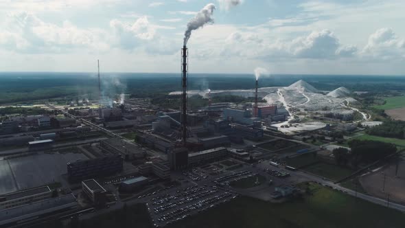 Mining and Processing Plant, View of Pipes and Smoke, Mineral Piles, Mountains of Minerlas and Sand