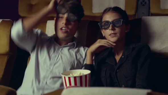 Man and Woman in the Cinema Watching a 3D Movie