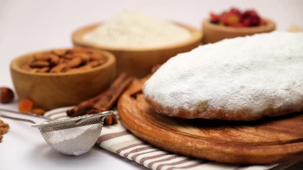 Traditional Christmas Stollen Cake with Recipe Ingredients Isolated on White Background