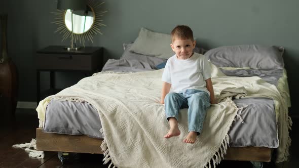 Happy Baby Boy in Jeans and Tshirt