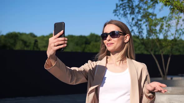 Beautiful Happy Young Business Woman Making a Video Call Smiling Talking