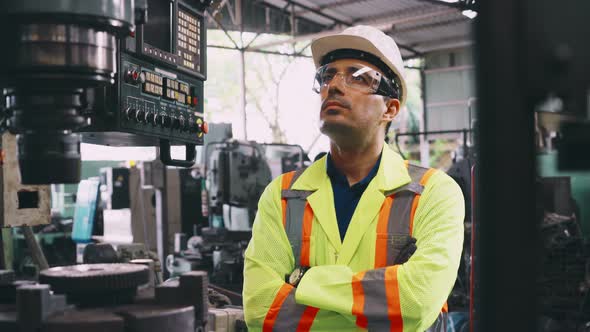 Smart Factory Worker Using Machine in Factory Workshop