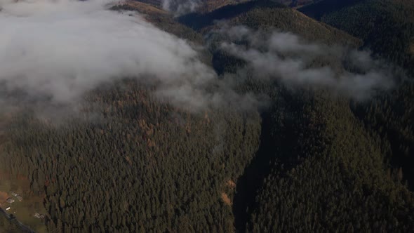 Aerial View of Time Lapse Sea of Fog Floating Rolling Over Mountain Valley Hills Islands at Sunrise